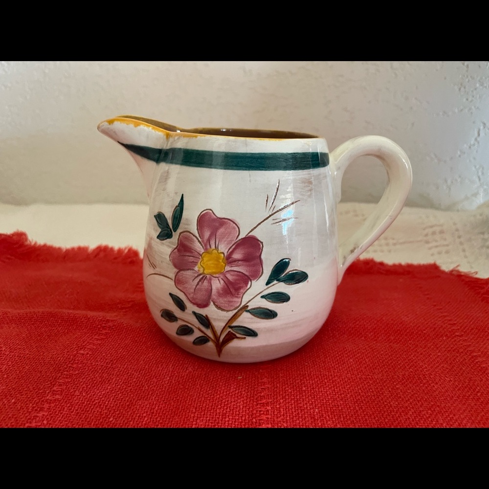 Vtg. ceramic milk pitcher with flour and leaves makers mark on bottom.